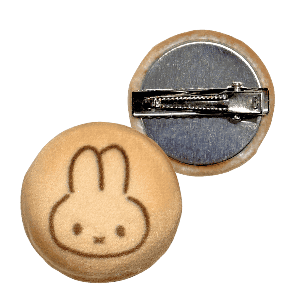 Plush cookie hair clip with a cartoon rabbit face design